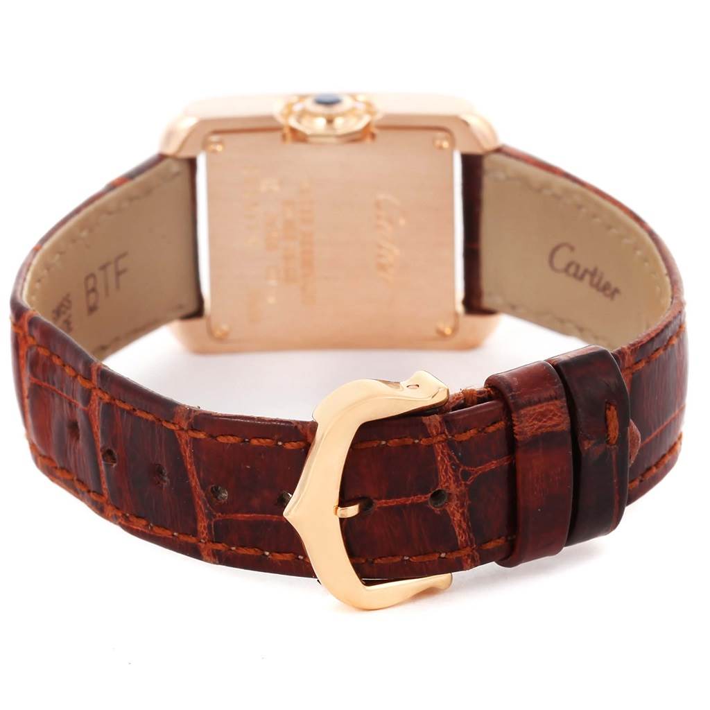 The image shows the back and clasp of a Cartier Tank Anglaise WT100024 Women
s Rose Gold Silver Dial WT100024 Women
s Rose Gold Silver Dial watch with a brown leather strap.