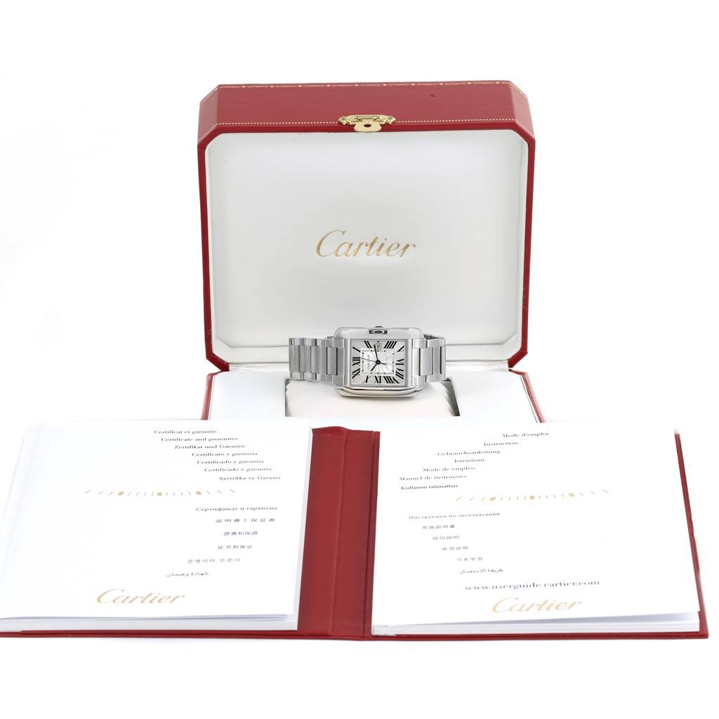 The photo shows a Cartier Tank Anglaise W5310009 Men's Stainless Steel Silver Dial W5310009 Men's Stainless Steel Silver Dial watch in its box, with instruction manuals placed in front at a slightly elevated angle.
