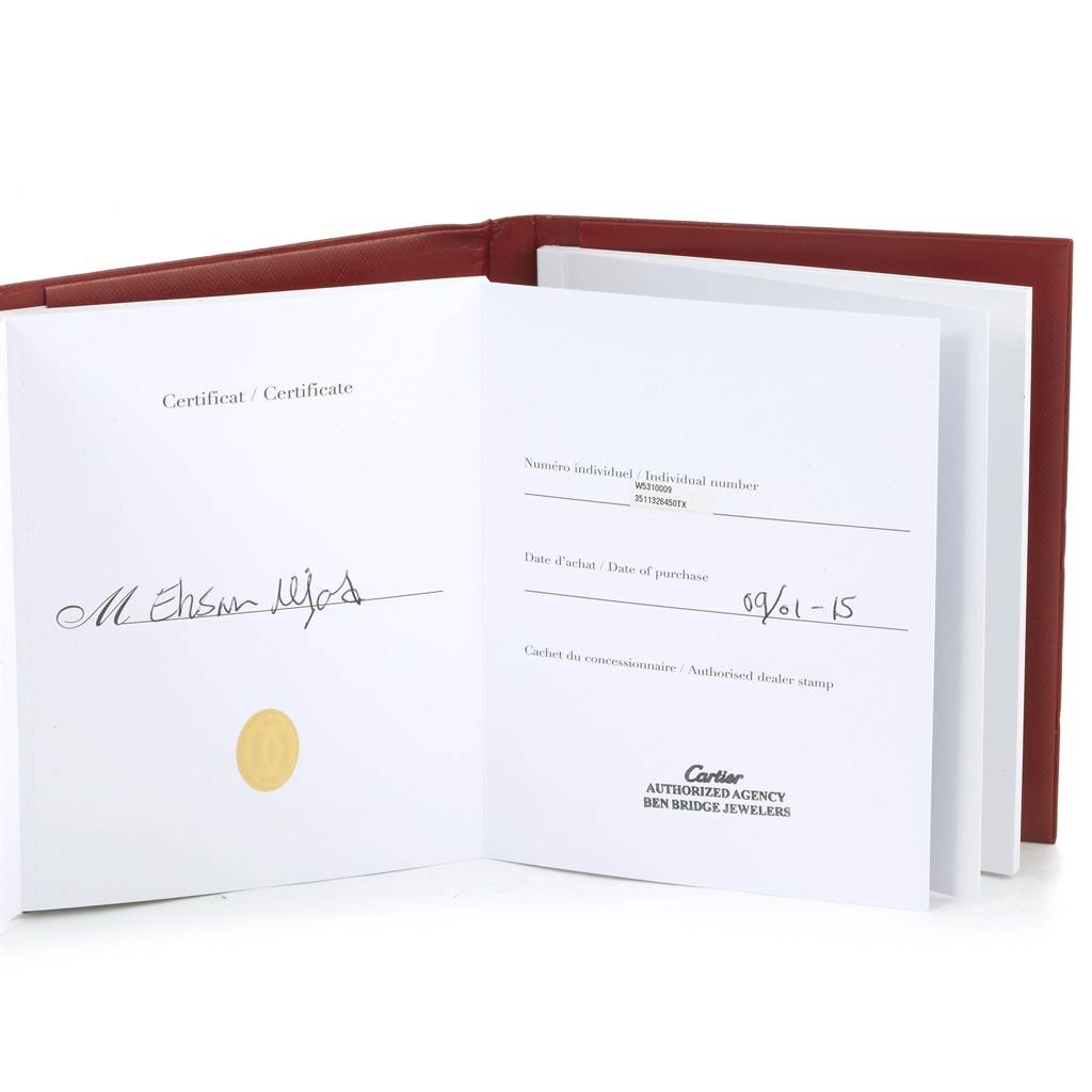 The image shows an open certificate booklet for the Cartier Tank Anglaise W5310009 Men's Stainless Steel Silver Dial W5310009 Men's Stainless Steel Silver Dial model with the serial number and date of purchase visible.