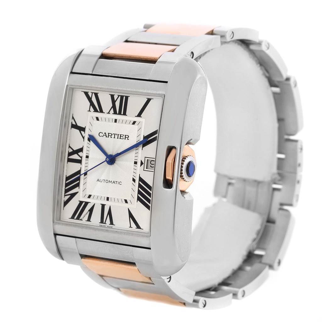 The image shows a Cartier Tank Anglaise W5310006 Men's Steel and Gold (two tone) Silver Dial W5310006 Men's Steel and Gold (two tone) Silver Dial watch at an angle displaying the watch face, crown, and bracelet.