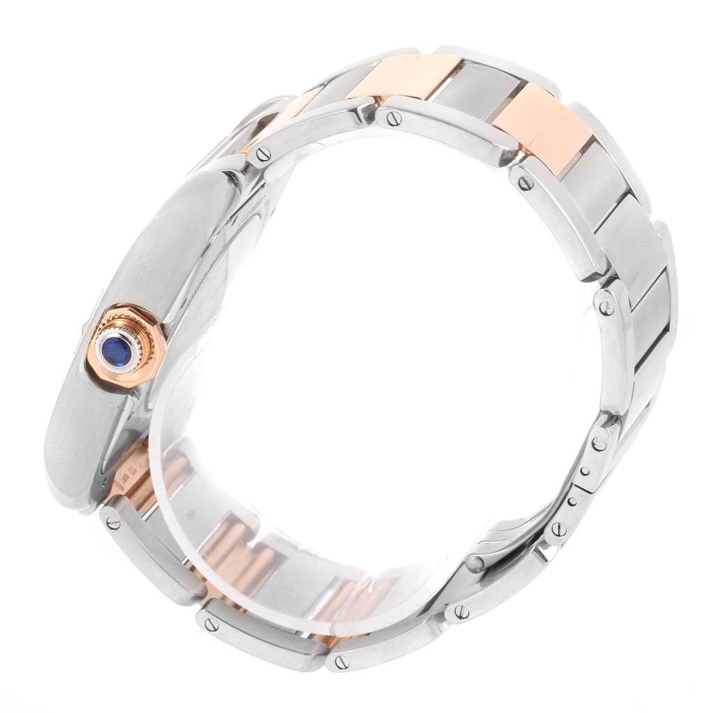 The image shows the side view of a Cartier Tank Anglaise W5310006 Men's Steel and Gold (two tone) Silver Dial W5310006 Men's Steel and Gold (two tone) Silver Dial watch, highlighting its two-tone bracelet and crown.