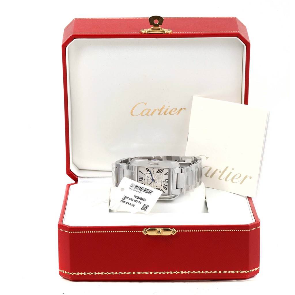 The image shows a Cartier Tank Anglaise W5310009 Men's Stainless Steel Silver Dial W5310009 Men's Stainless Steel Silver Dial watch from a front angle, placed in an open red box with accompanying booklets and tags.