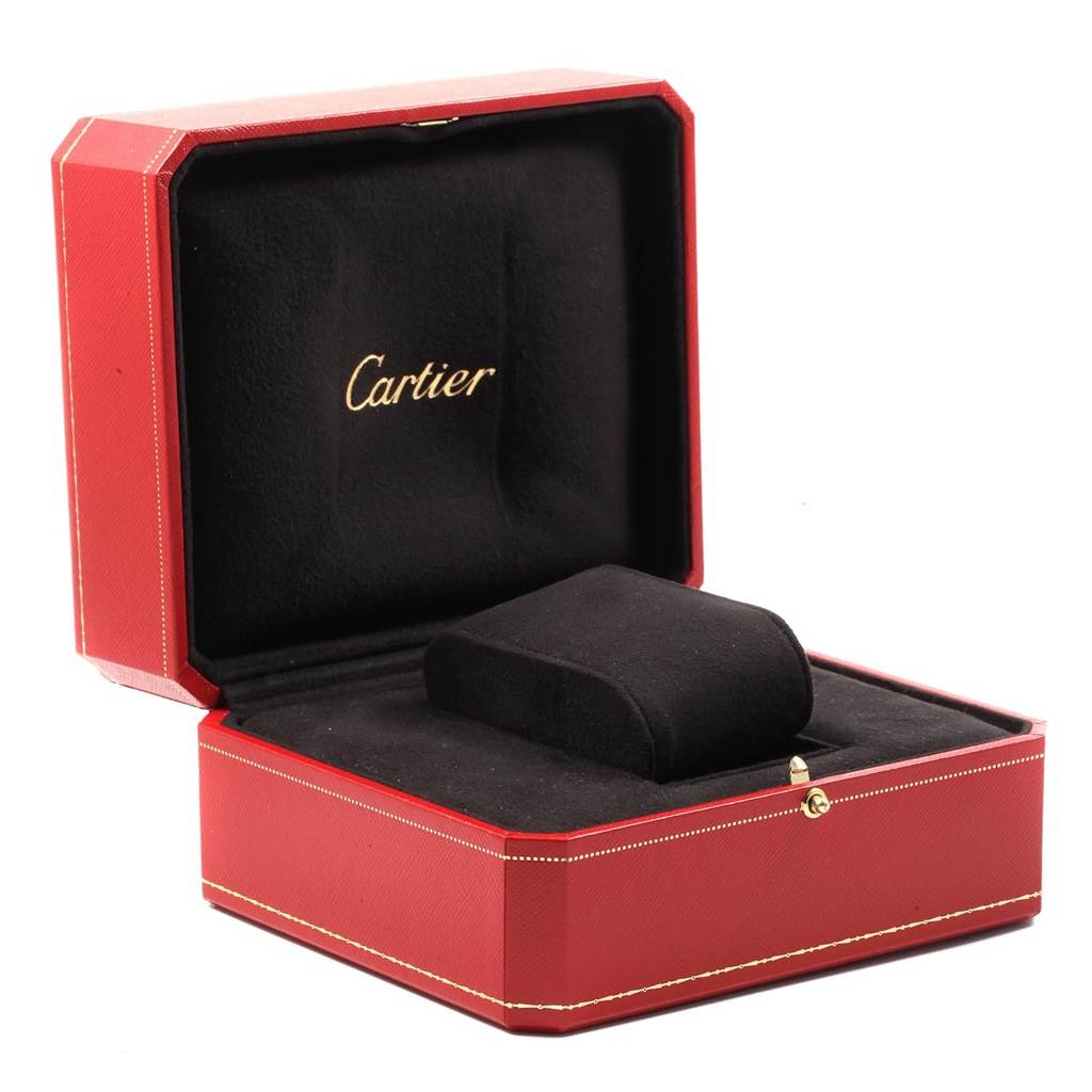 This image shows an open Cartier watch box for the Tank Anglaise model, revealing its black interior cushion.
