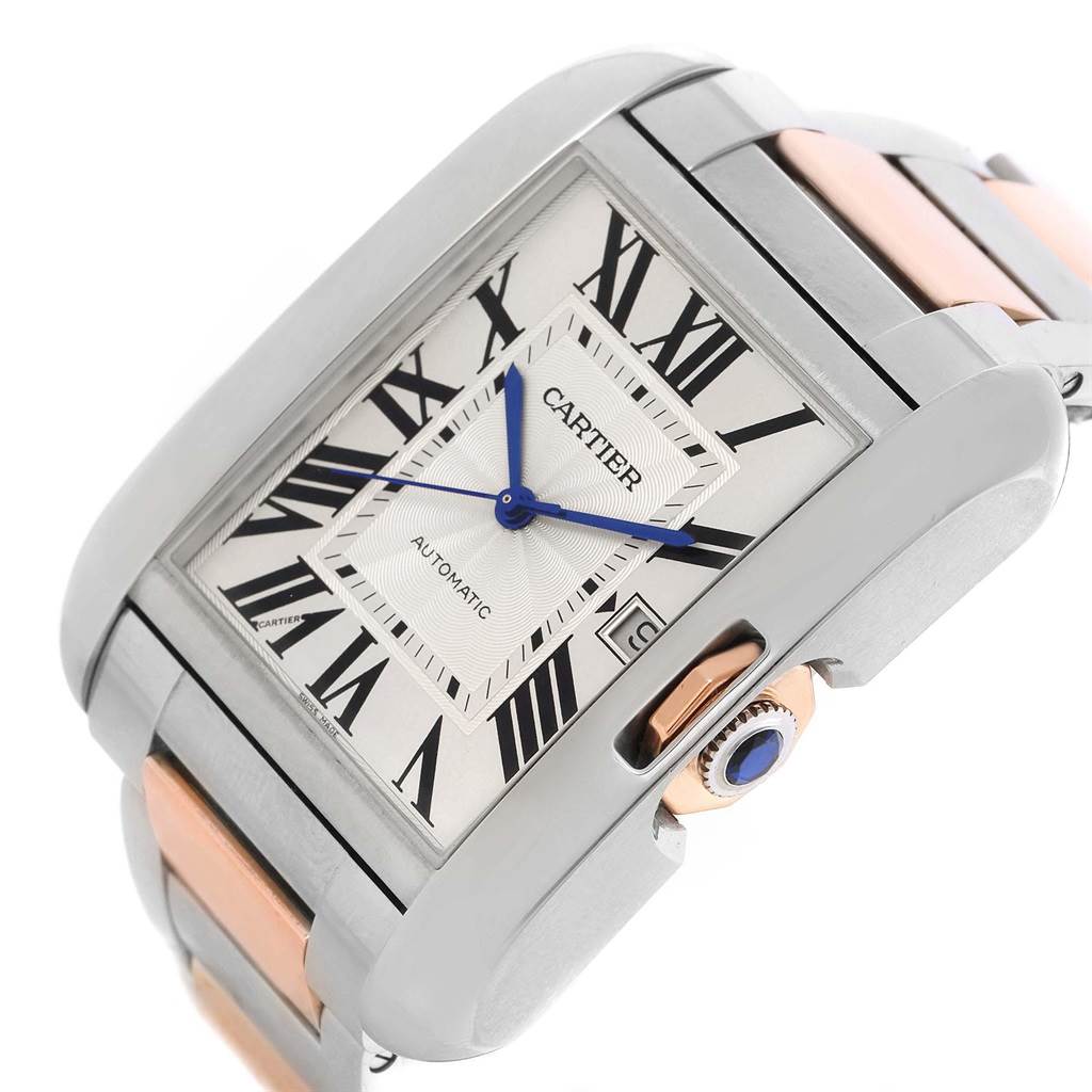 The image shows a close-up angle of the Cartier Tank Anglaise W5310006 Men's Steel and Gold (two tone) Silver Dial W5310006 Men's Steel and Gold (two tone) Silver Dial watch face, highlighting its Roman numeral dial, signature blue hands, and crown.