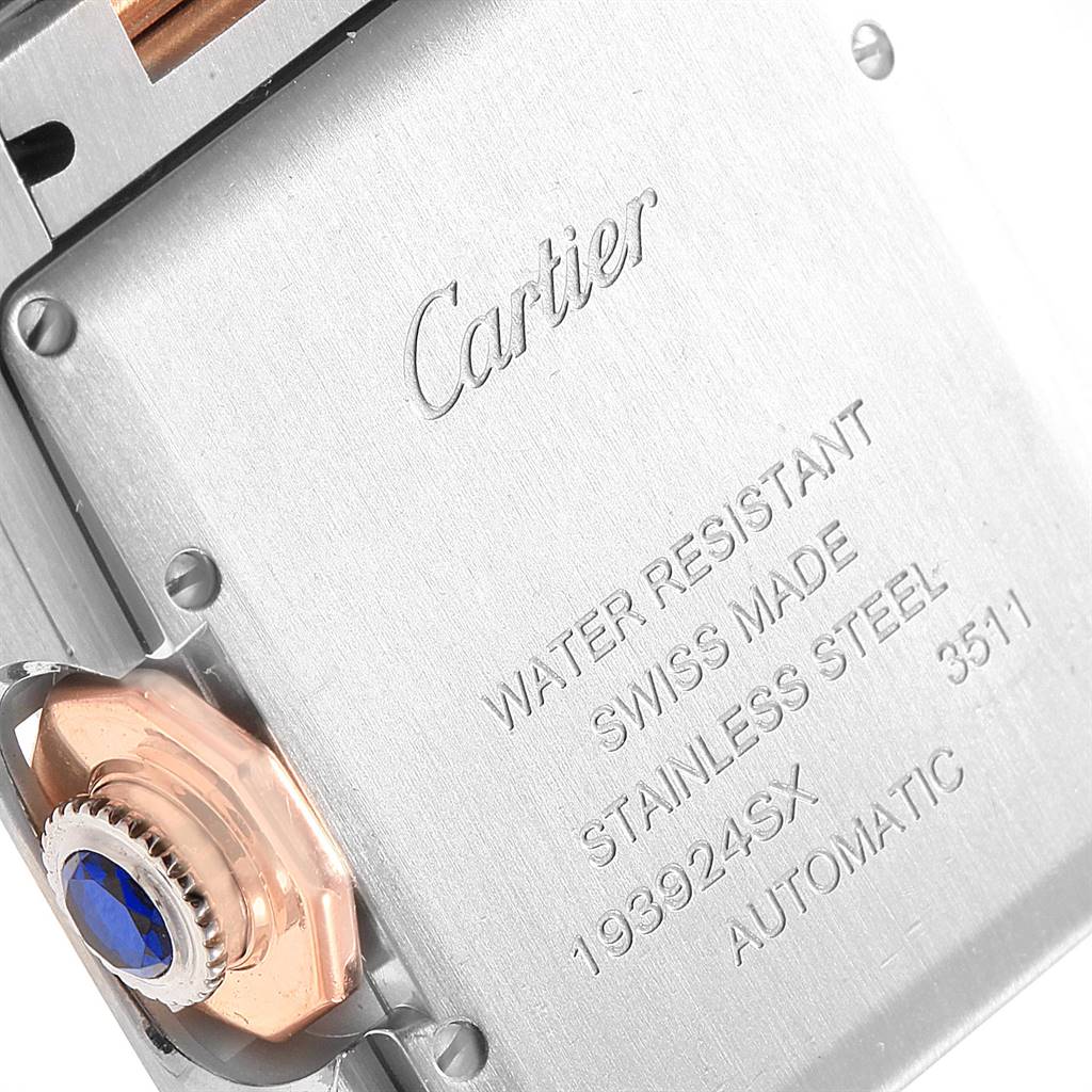 The image shows the back case and winding crown of a Cartier Tank Anglaise W5310007 Men's Steel and Gold (two tone) Silver Dial W5310007 Men's Steel and Gold (two tone) Silver Dial watch, highlighting the brand engraving and specifications.