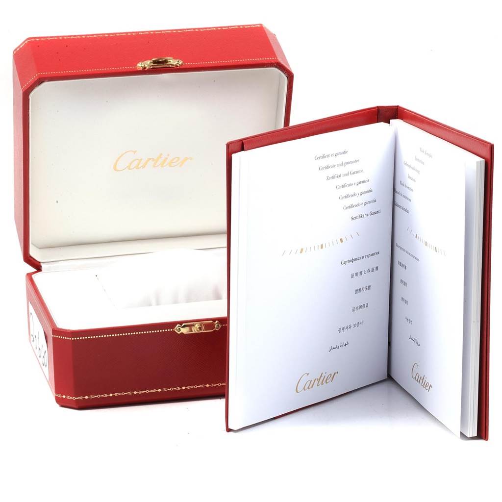 The image shows the open box and certificate booklet for a Cartier Tank Anglaise W5310009 Men
s Stainless Steel Silver Dial W5310009 Men
s Stainless Steel Silver Dial watch.