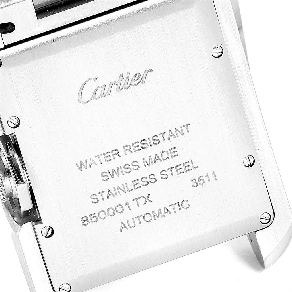 The image shows the back case of the Cartier Tank Anglaise W5310009 Men's Stainless Steel Silver Dial W5310009 Men's Stainless Steel Silver Dial watch, displaying its engravings and screws.