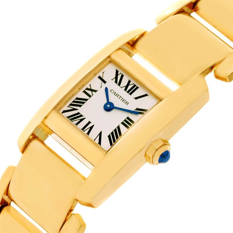 The image shows a Cartier Tankissime W650037H Women's Yellow Gold Silver Dial W650037H Women's Yellow Gold Silver Dial model watch at an angle highlighting the face, crown, and part of the bracelet.
