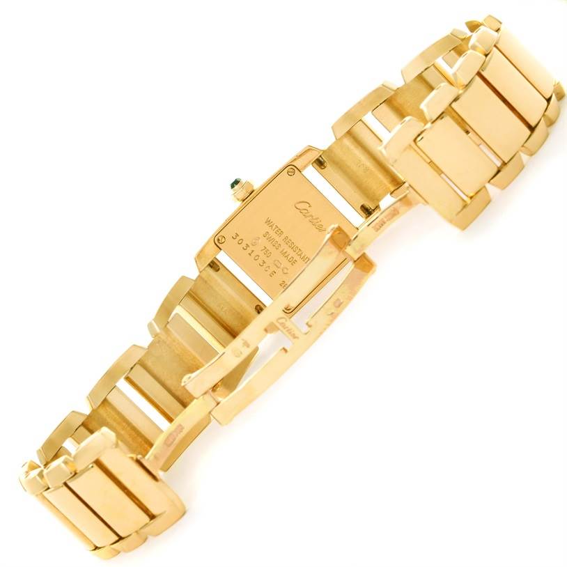 This image shows the back case and bracelet of the Cartier Tankissime W650037H Women's Yellow Gold Silver Dial W650037H Women's Yellow Gold Silver Dial watch in a partially open position.