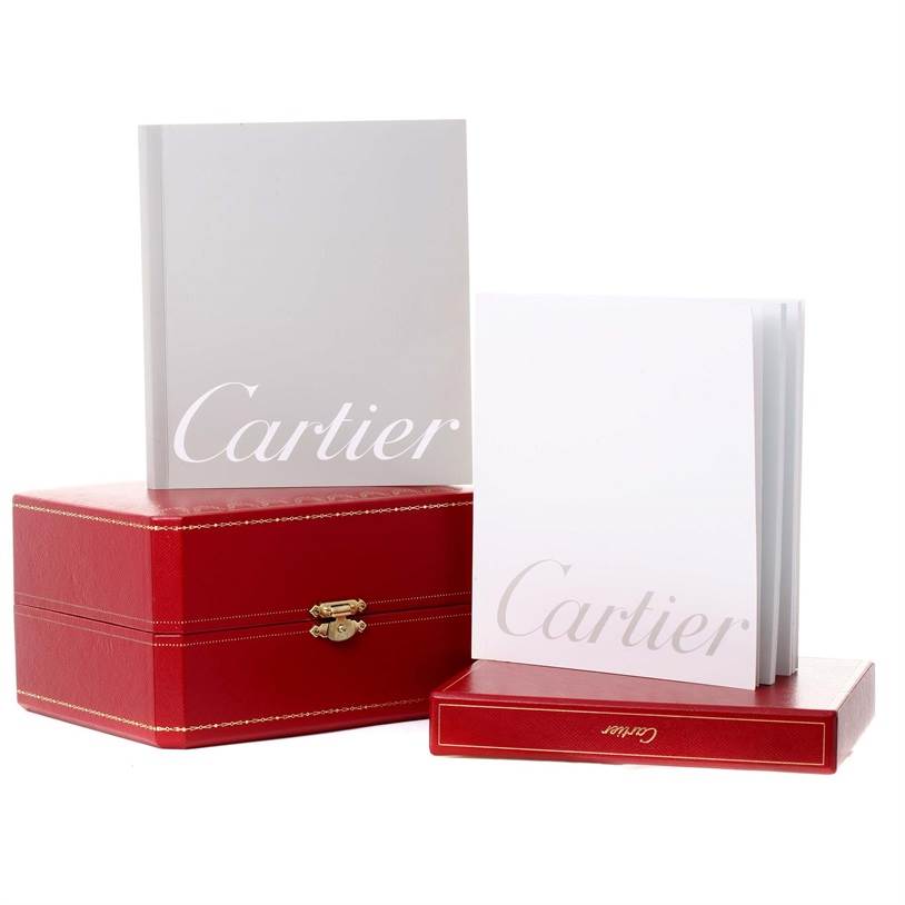 The image shows Cartier Tankissime W650037H Women's Yellow Gold Silver Dial W650037H Women's Yellow Gold Silver Dial watch accessories including a red box and manuals.