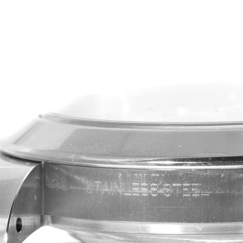 The image shows the side view of the bezel, crystal, and case back of a Rolex Datejust 41 116300 Men's Stainless Steel Blue Dial 116300 Men's Stainless Steel Blue Dial watch, with emphasis on the stainless steel engraving.