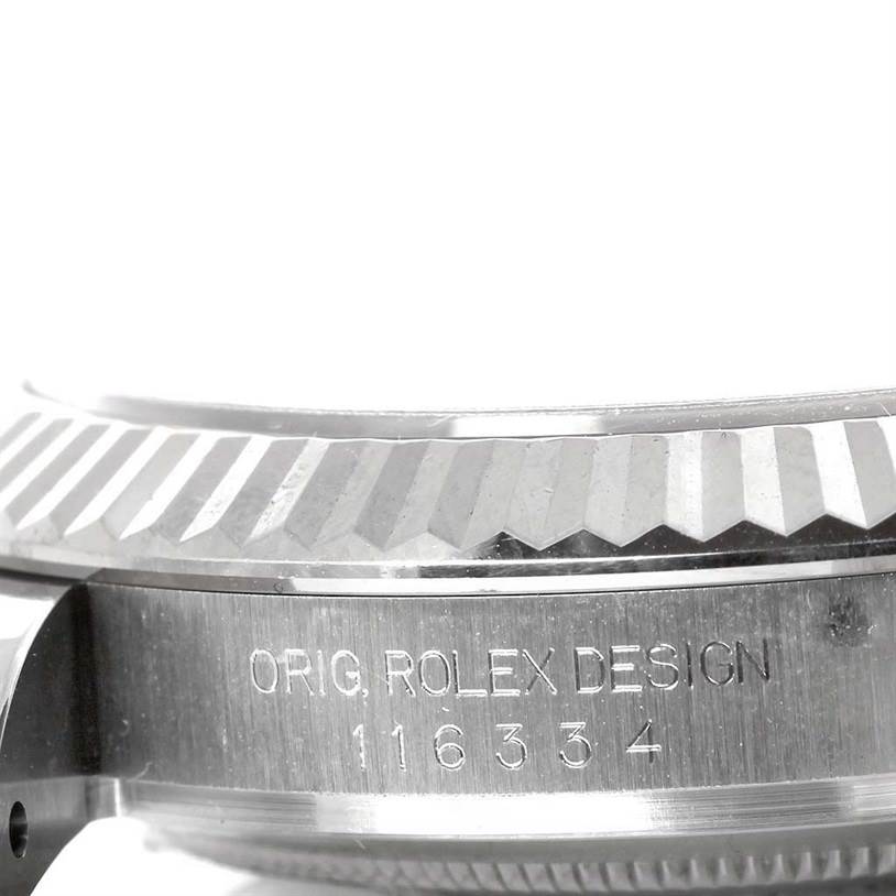 This image shows a close-up angle of the side case and fluted bezel of the Rolex Datejust 41 116334 Men's Stainless Steel White Dial 116334 Men's Stainless Steel White Dial, highlighting the engraved model information.