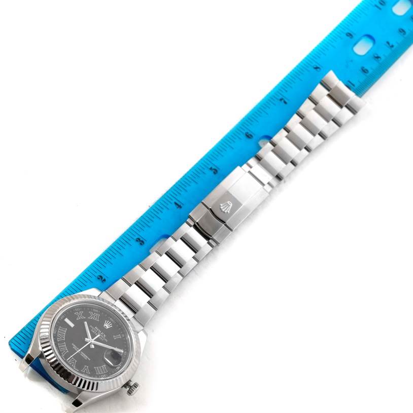 The image shows a Rolex Datejust 41 116334 Men's Stainless Steel Grey Dial 116334 Men's Stainless Steel Grey Dial watch laid flat next to a blue ruler, highlighting the face, bracelet, and clasp.