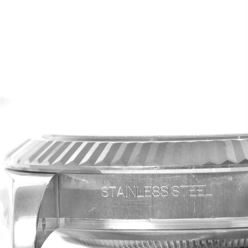 This side view showcases the stainless steel casing and the fluted bezel of the Rolex Datejust 41 116334 Men's Stainless Steel Grey Dial 116334 Men's Stainless Steel Grey Dial model.