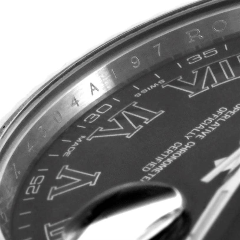 This close-up image of the Rolex Datejust 41 116334 Men's Stainless Steel Grey Dial 116334 Men's Stainless Steel Grey Dial shows part of the watch face, bezel, and Roman numeral markers.
