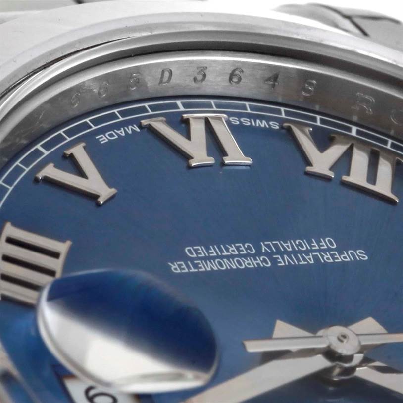 The image shows a close-up of the dial, Roman numerals, and date magnifier of a Rolex Datejust 41 116300 Men's Stainless Steel Blue Dial 116300 Men's Stainless Steel Blue Dial watch.
