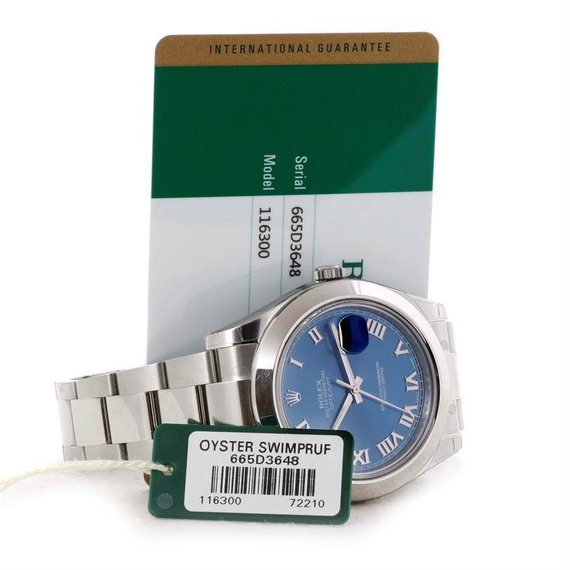 The image shows a Rolex Datejust 41 116300 Men's Stainless Steel Blue Dial 116300 Men's Stainless Steel Blue Dial watch with a blue dial, alongside its international guarantee card and Oyster Swimpruf tag.
