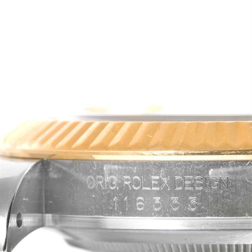 This image shows a close-up side view of the case and fluted bezel of a Rolex Datejust 41 116333 Men's Steel and Gold (two tone) Champagne Dial 116333 Men's Steel and Gold (two tone) Champagne Dial with "ORIG. ROLEX DESIGN" and model number engraving.