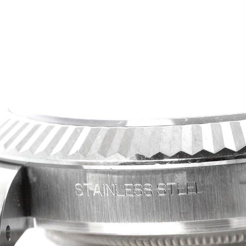This close-up image shows the side view of the bezel and case of a Rolex Datejust 41 116334 Men's Stainless Steel White Dial 116334 Men's Stainless Steel White Dial in stainless steel.