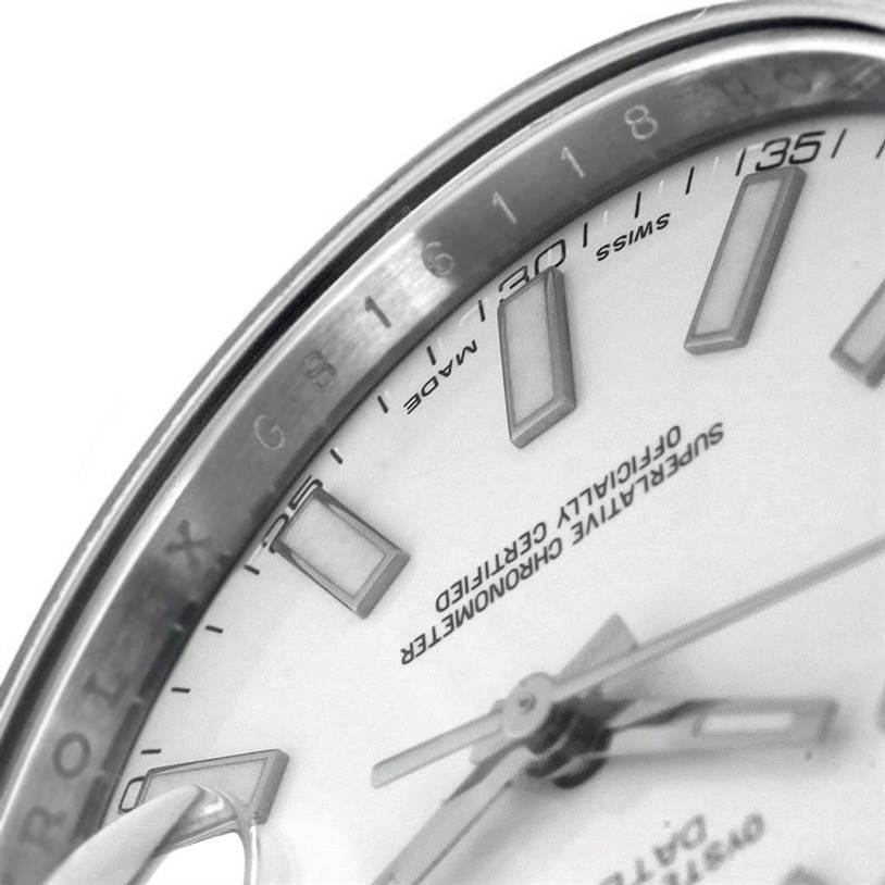 This close-up image of the Rolex Datejust 41 116334 Men's Stainless Steel White Dial 116334 Men's Stainless Steel White Dial watch shows the dial with hour markers, hands, and part of the bezel.
