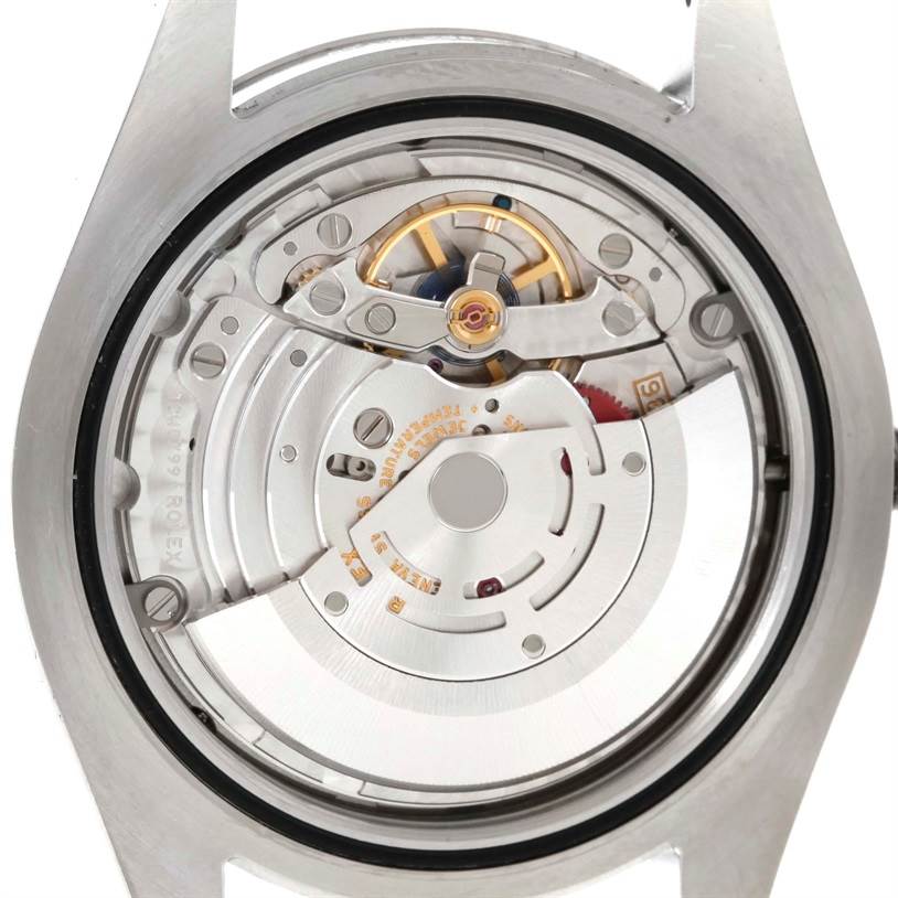 The image shows the back view of the Rolex Datejust 41 116334 Men's Stainless Steel Blue Dial 116334 Men's Stainless Steel Blue Dial watch, focusing on its intricate movement mechanism.