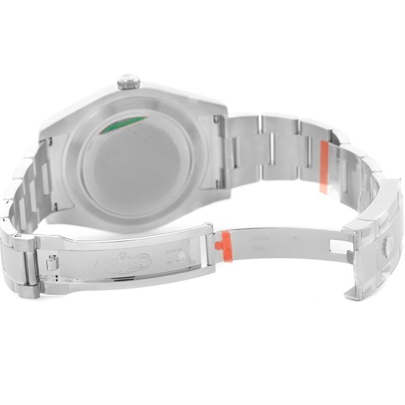 The image shows the back of a Rolex Datejust 41 116300 Stainless Steel Black Dial 116300 Stainless Steel Black Dial watch and its partially opened bracelet.