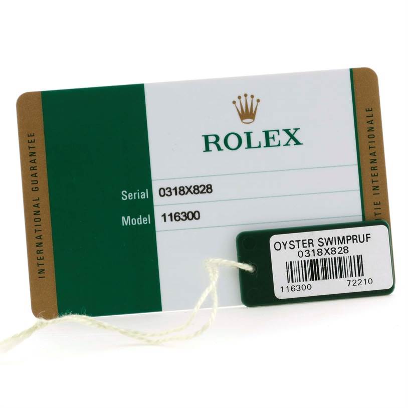 This image shows the warranty card and a tag for the Rolex Datejust 41 116300 Stainless Steel Black Dial 116300 Stainless Steel Black Dial model.