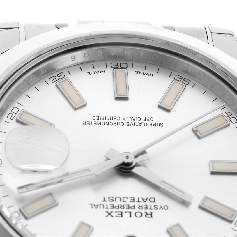 This close-up of a Rolex Datejust 41 116300 Stainless Steel Silver Dial 116300 Stainless Steel Silver Dial watch showcases the dial, hands, and Cyclops date magnifier at an angled view.