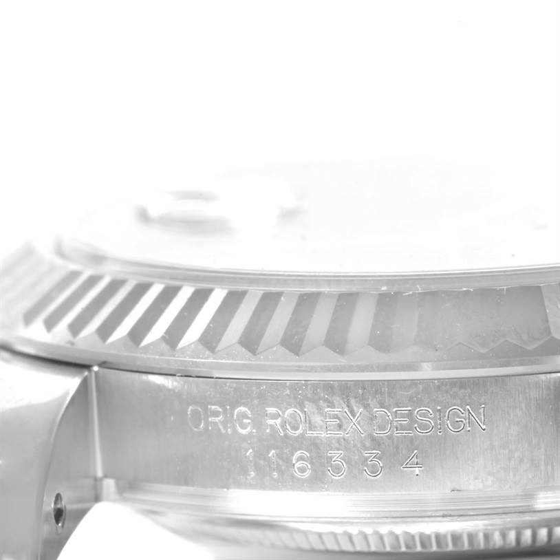 This image shows a close-up of the bezel and part of the case with the engraving "ORIG. ROLEX DESIGN" and the reference number on a Rolex Datejust 41 116334 Men
s Stainless Steel Grey Dial 116334 Men
s Stainless Steel Grey Dial.