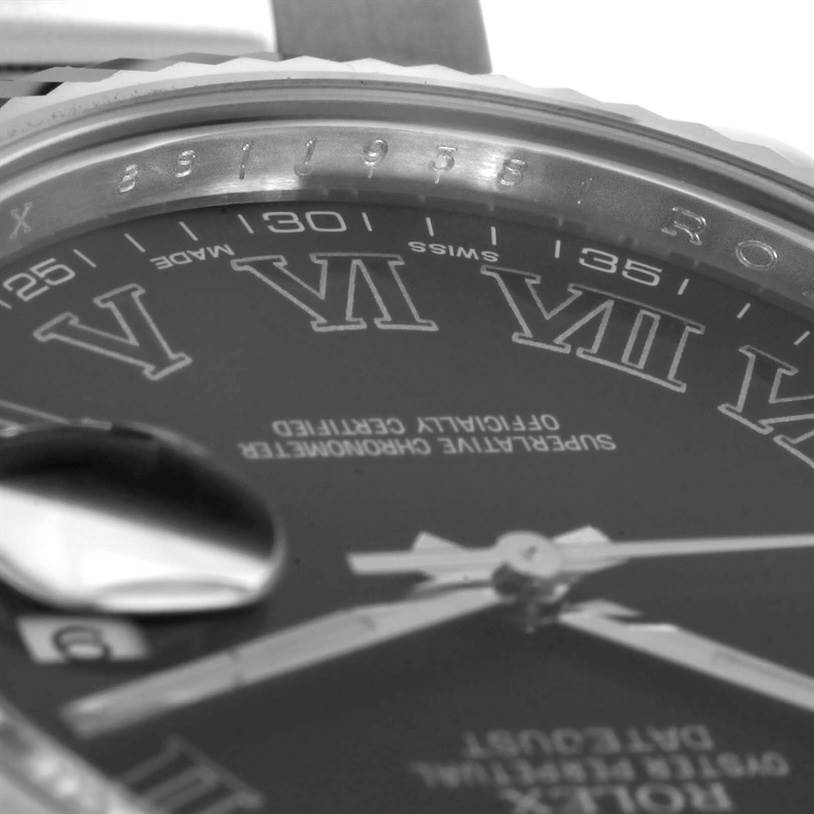 This image shows a close-up angle of the dial, date magnifier, and part of the bezel of the Rolex Datejust 41 116334 Men
s Stainless Steel Grey Dial 116334 Men
s Stainless Steel Grey Dial.