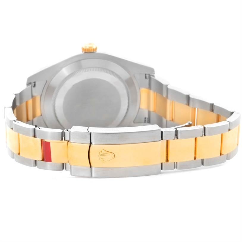 The image shows the back of a Rolex Datejust 41 116333 Men
s Steel and Gold (two tone) Black Dial 116333 Men
s Steel and Gold (two tone) Black Dial watch, focusing on the clasp and the two-tone metal bracelet.