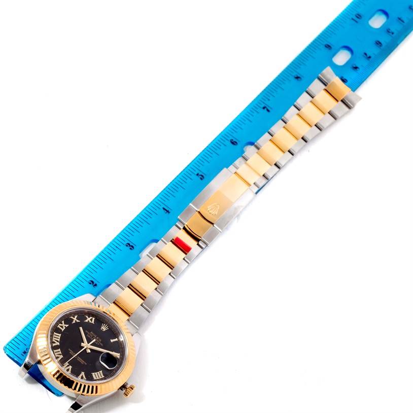 The image shows a top-down view of the Rolex Datejust 41 116333 Men
s Steel and Gold (two tone) Black Dial 116333 Men
s Steel and Gold (two tone) Black Dial watch, displaying the watch face, bezel, and metal bracelet alongside a blue ruler.