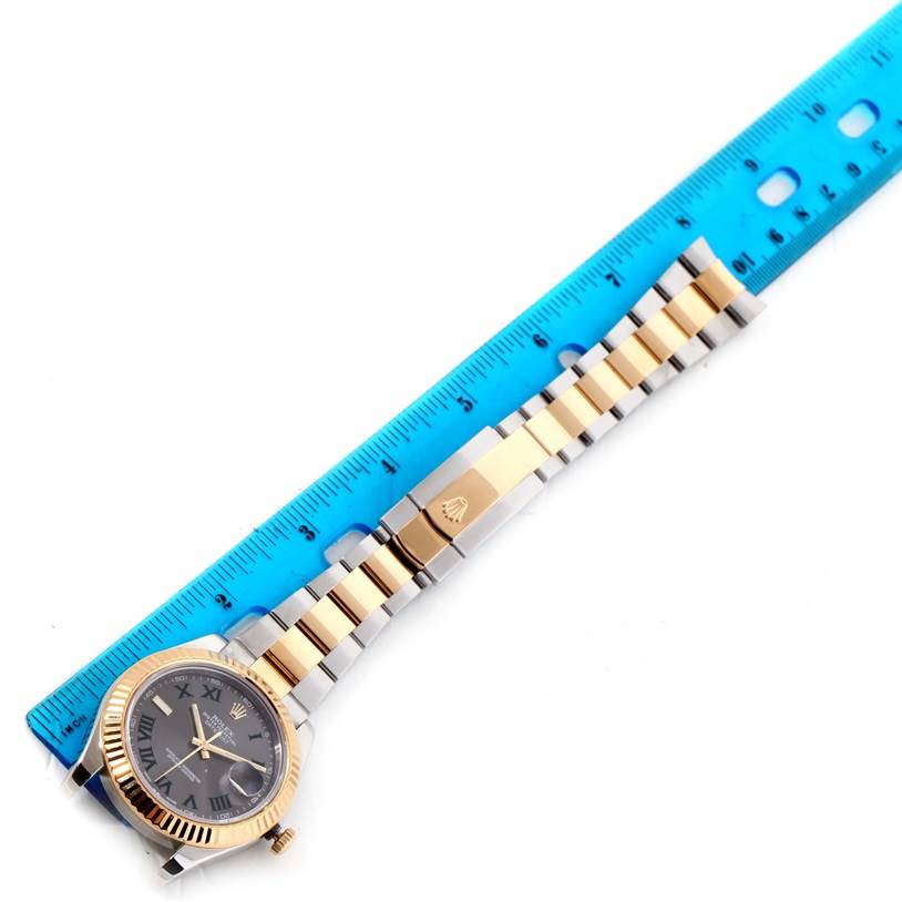 The image shows a Rolex Datejust 41 116333GYRO Men's Steel and Gold (two tone) Grey Dial 116333GYRO Men's Steel and Gold (two tone) Grey Dial watch laid flat, with a blue ruler for scale.