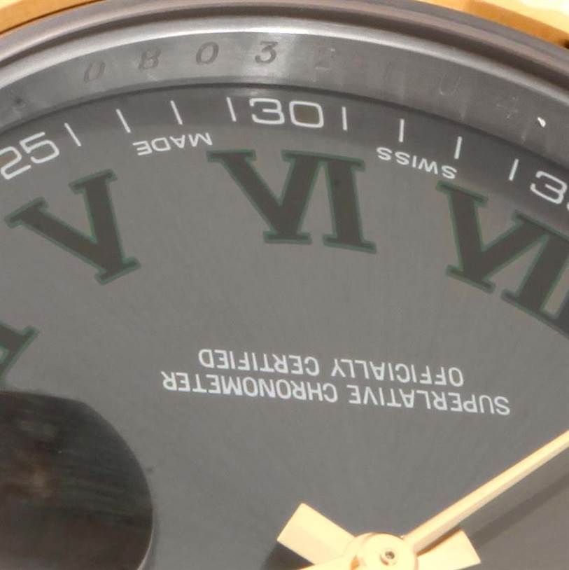The image shows a close-up of the dial of a Rolex Datejust 41 116333GYRO Men's Steel and Gold (two tone) Grey Dial 116333GYRO Men's Steel and Gold (two tone) Grey Dial watch, displaying the Roman numerals, date indicators, and certification text.