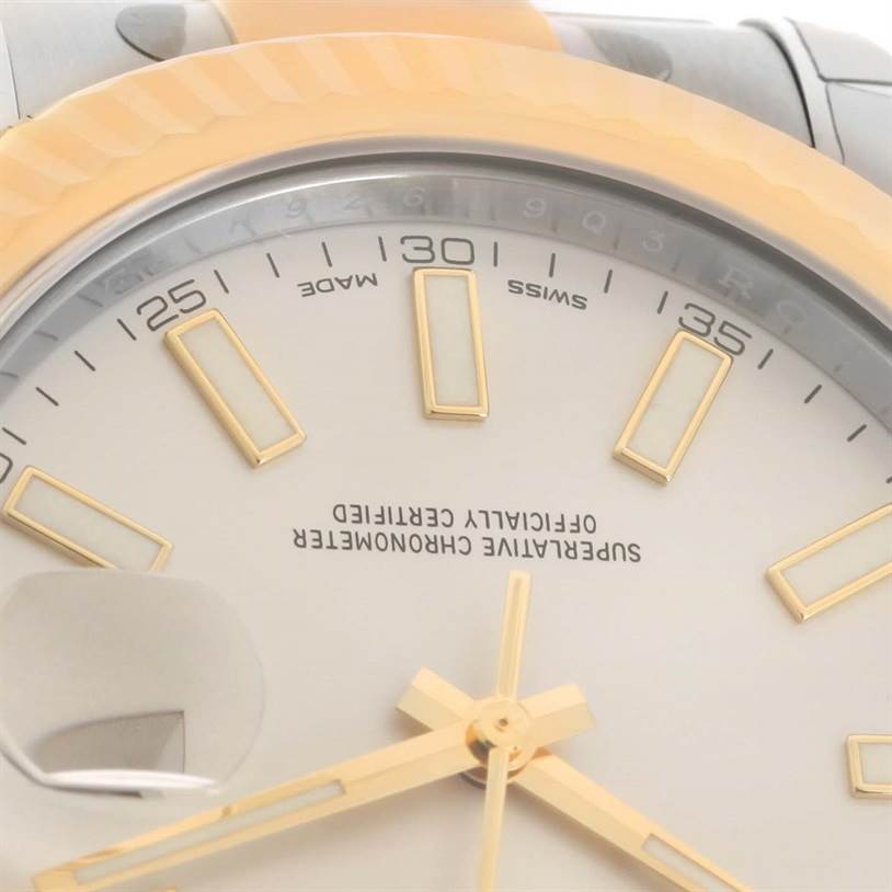 Close-up of the dial and part of the bezel of a Rolex Datejust 41 116333ISO Men's Steel and Gold (two tone) Beige Dial 116333ISO Men's Steel and Gold (two tone) Beige Dial, showing the hands, indices, and date magnifier.