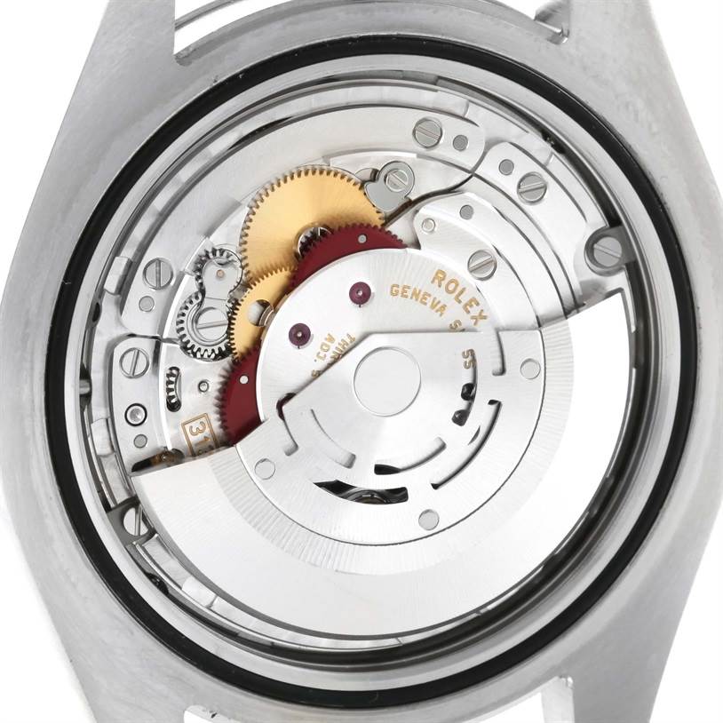 This image shows the inner movement mechanism of a Rolex Datejust 41 116300 Men's Stainless Steel Black Dial 116300 Men's Stainless Steel Black Dial, focusing on the gears and rotor.