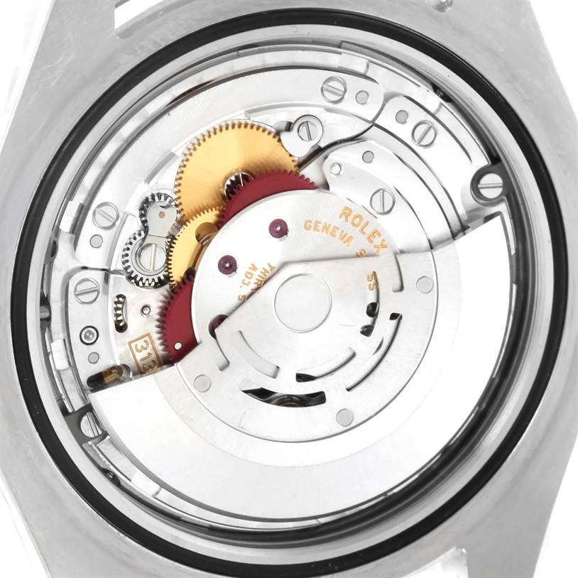 This image shows the inner mechanical movement of a Rolex Datejust 41 116334BLRO Men's Stainless Steel Blue Dial 116334BLRO Men's Stainless Steel Blue Dial model, including gears and rotors.