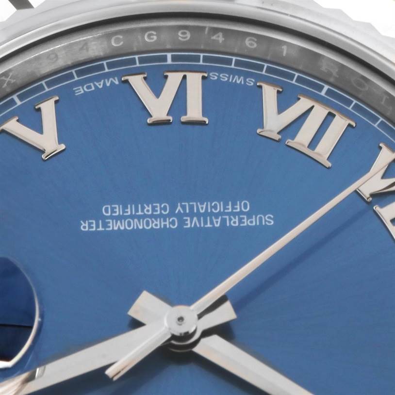 The image shows a close-up of the dial and Roman numeral markers on a Rolex Datejust 41 116334BLRO Men's Stainless Steel Blue Dial 116334BLRO Men's Stainless Steel Blue Dial watch, highlighting the hands and "Swiss Made" text.