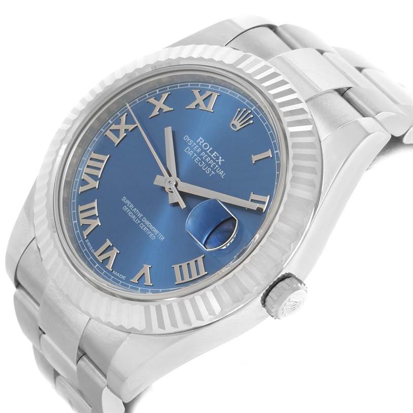 The image shows a Rolex Datejust 41 116334BLRO Men's Stainless Steel Blue Dial 116334BLRO Men's Stainless Steel Blue Dial watch from an angled view featuring its blue dial, Roman numerals, and fluted bezel.