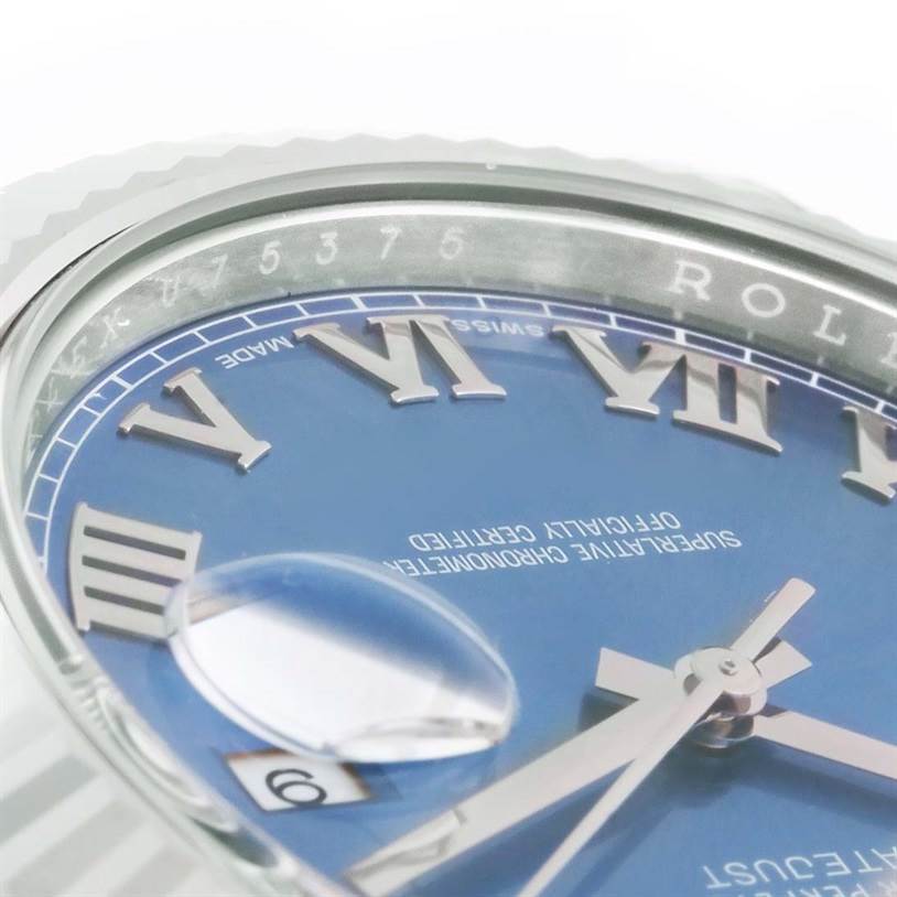 This close-up image of a Rolex Datejust 41 116334BLRO Men's Stainless Steel Blue Dial 116334BLRO Men's Stainless Steel Blue Dial watch shows its blue dial, Roman numerals, and date magnifier.