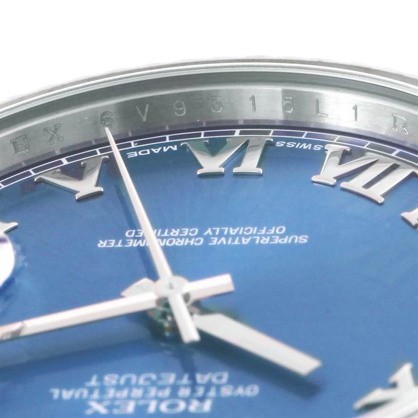 This image shows a close-up of the dial and bezel of the Rolex Datejust 41 116334BLRO Men's Stainless Steel Blue Dial 116334BLRO Men's Stainless Steel Blue Dial watch, highlighting the Roman numerals and branding.