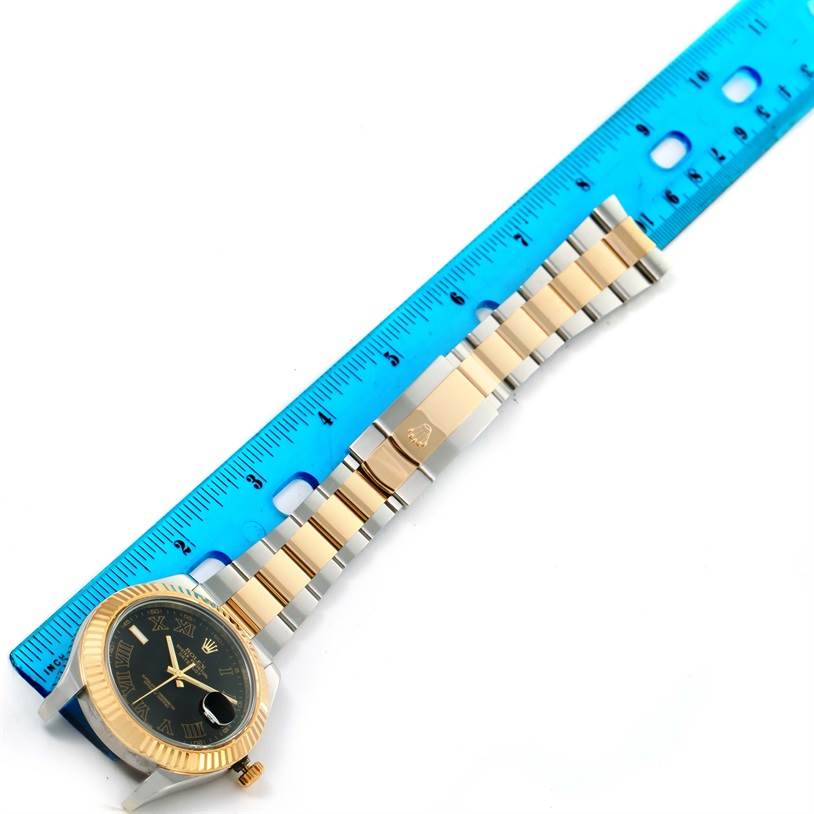 The image shows a Rolex Datejust 41 116333 Men's Steel and Gold (two tone) Grey Dial 116333 Men's Steel and Gold (two tone) Grey Dial watch with a portion of its band and a blue ruler for scale.