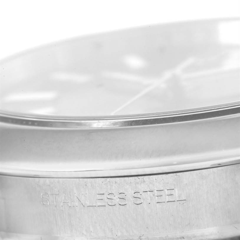 The image shows a close-up side angle of the case and bezel of a Rolex Datejust 41 116300 Men's Stainless Steel Black Dial 116300 Men's Stainless Steel Black Dial, with "STAINLESS STEEL" engraved on the side.