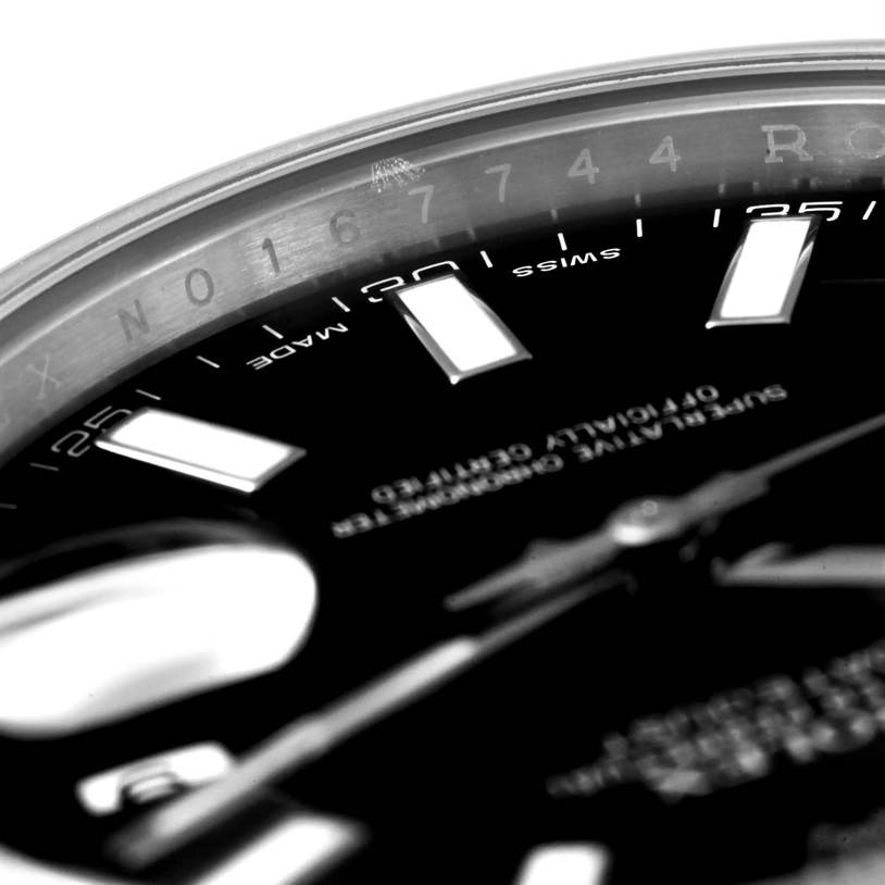 This close-up image of the Rolex Datejust 41 116300 Men's Stainless Steel Black Dial 116300 Men's Stainless Steel Black Dial showcases the dial, hands, and part of the rehaut.