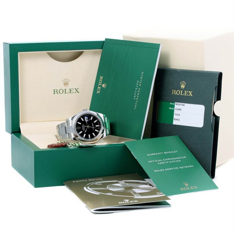 The Rolex Datejust 41 116300 Men's Stainless Steel Black Dial 116300 Men's Stainless Steel Black Dial watch is displayed in its box, with accompanying warranty booklets and certification papers.