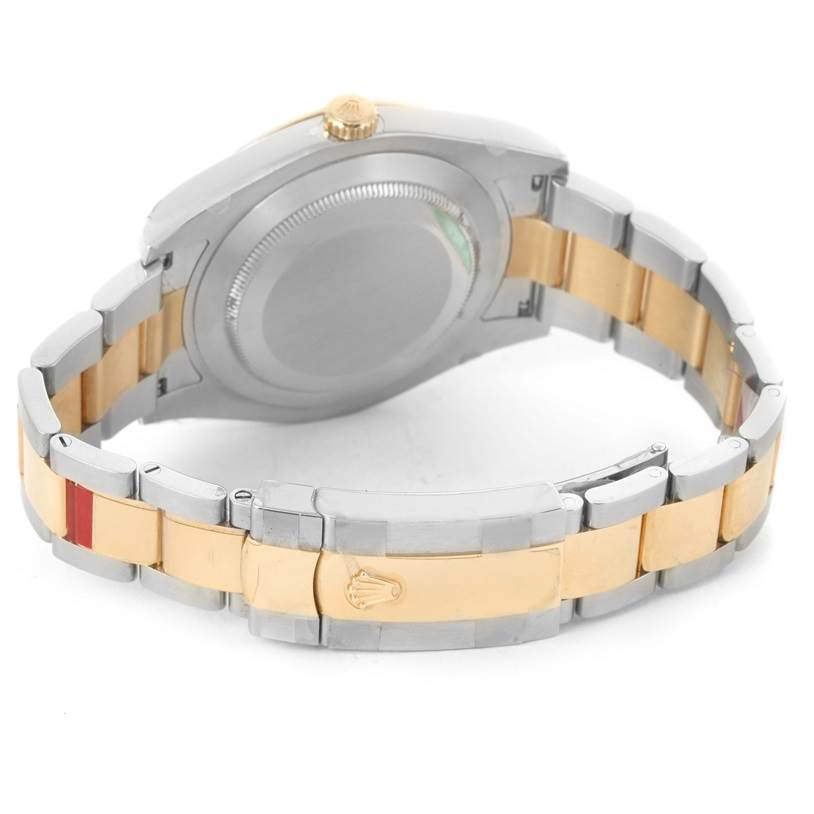 The Rolex Datejust 41 116333 Men's Steel and Gold (two tone) Black Dial 116333 Men's Steel and Gold (two tone) Black Dial watch is shown from the back, highlighting its case back and two-tone bracelet.