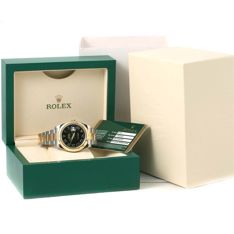 The Rolex Datejust 41 116333 Men's Steel and Gold (two tone) Black Dial 116333 Men's Steel and Gold (two tone) Black Dial is shown inside its open green box at an angle displaying the face, band, and a warranty card.
