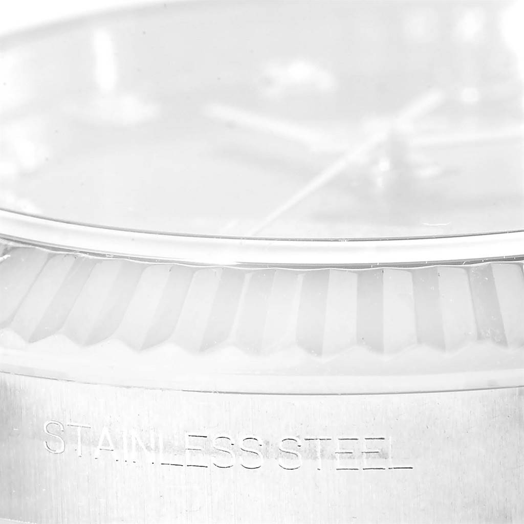 The image shows a close-up side angle of the Rolex Datejust 41 116334BLRO Men's Stainless Steel Grey Dial 116334BLRO Men's Stainless Steel Grey Dial, focusing on part of the bezel and the engraved "STAINLESS STEEL" text.