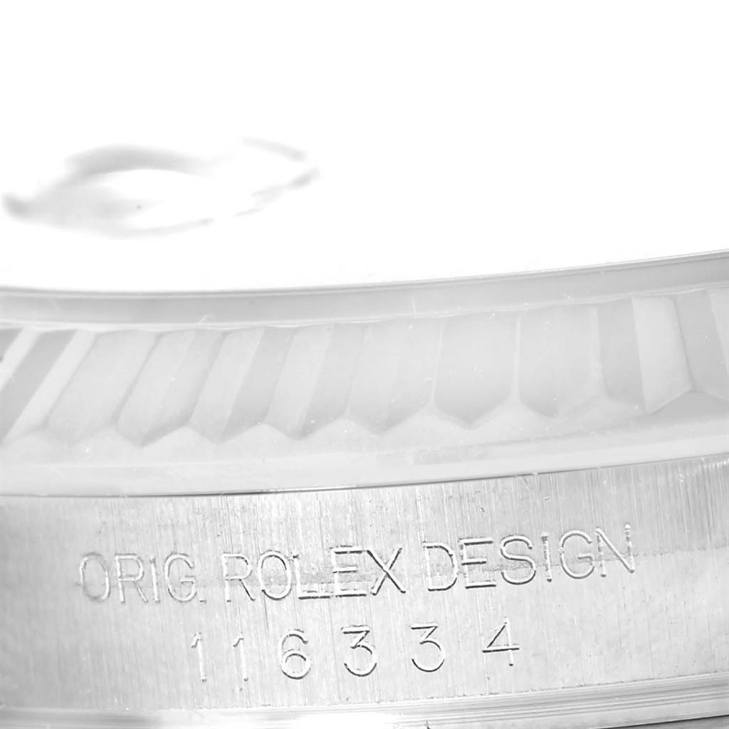 This close-up image shows the engraved design details and model number on the case of a Rolex Datejust 41 116334BLRO Men's Stainless Steel Grey Dial 116334BLRO Men's Stainless Steel Grey Dial watch.