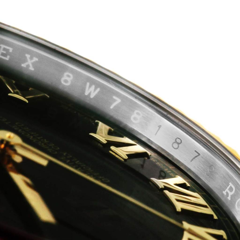 The image shows a close-up angle of the bezel and dial of the Rolex Datejust 41 116333 Men's Steel and Gold (two tone) Black Dial 116333 Men's Steel and Gold (two tone) Black Dial, highlighting the Roman numerals and part of the serial number.